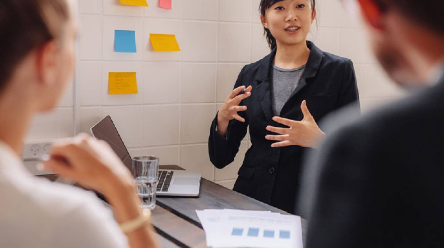 A young woman pitches an idea