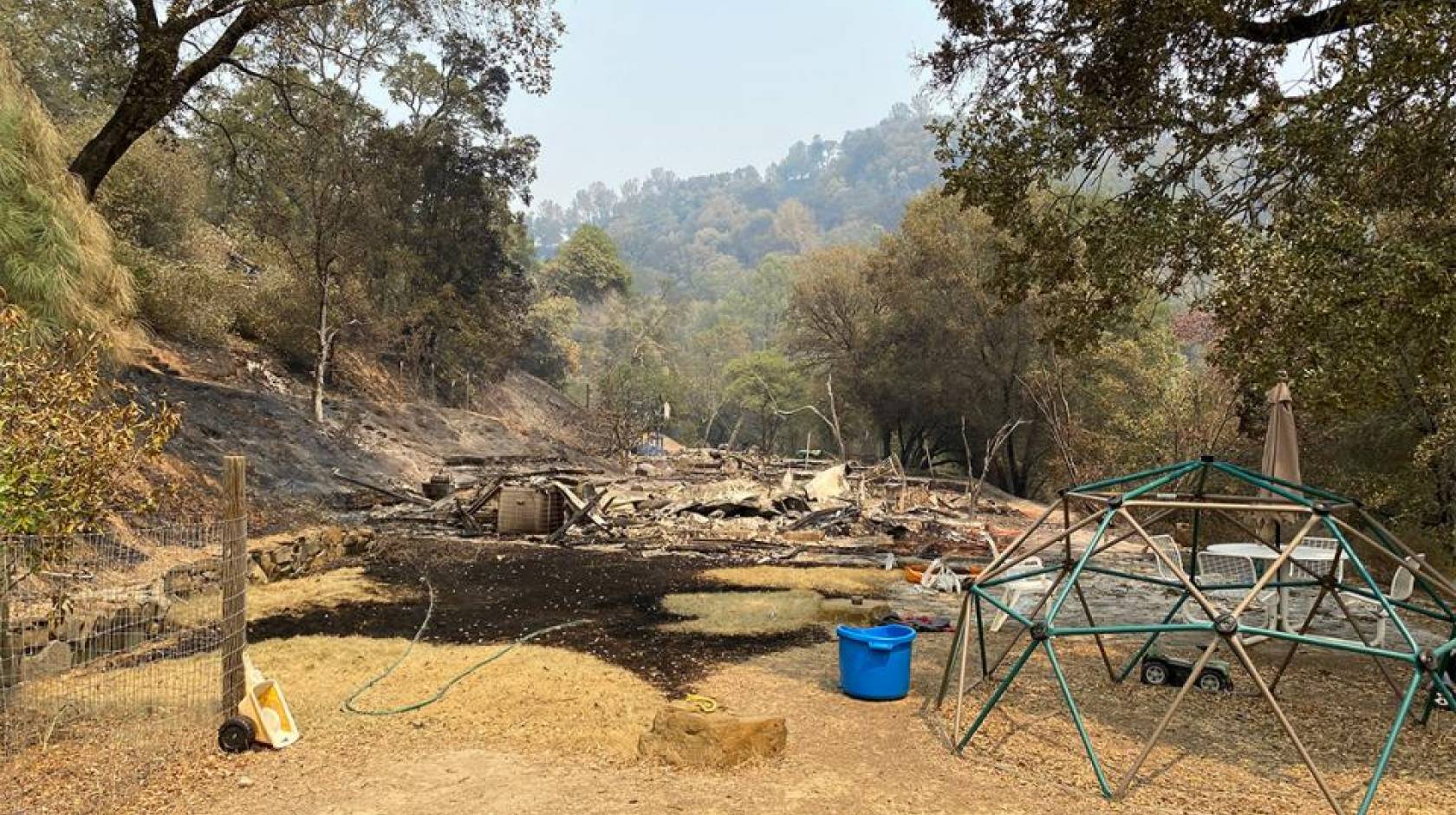 Quail Ridge Reserve director Shane Waddell’s house burned to the ground, leaving little more than the foundation and his children’s outdoor play structure.