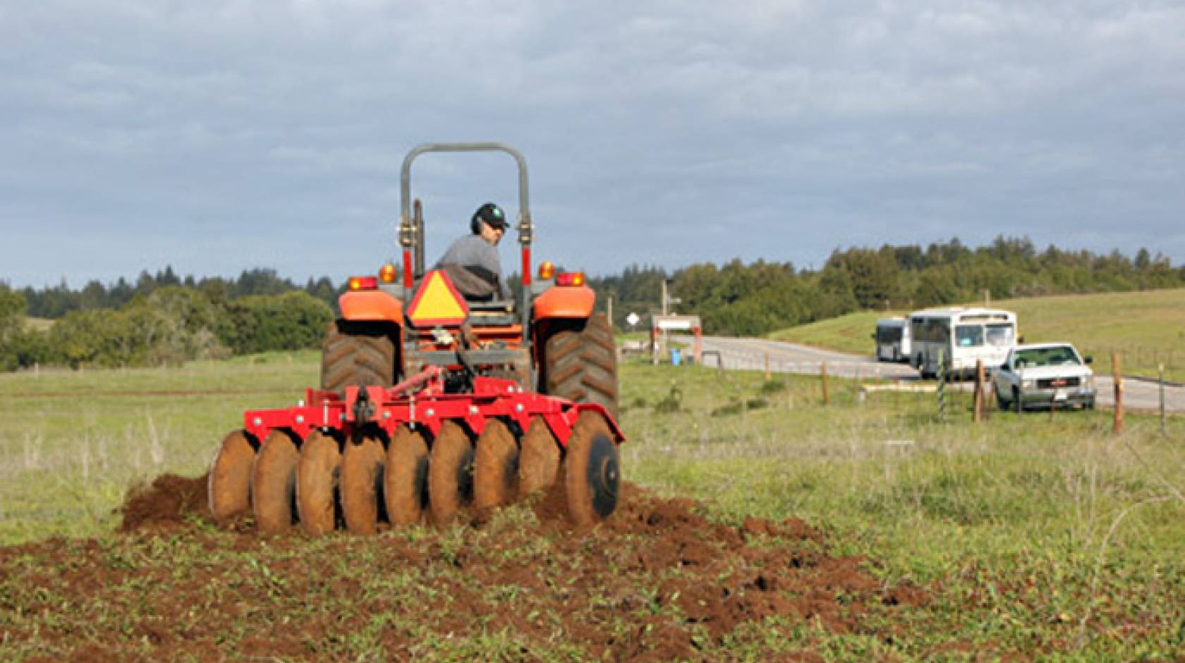 Darryl Wong, UCSC farm site and research lands manager, tills the new three-acre Quarry Field in anticipation of planting wheat before the rains. 