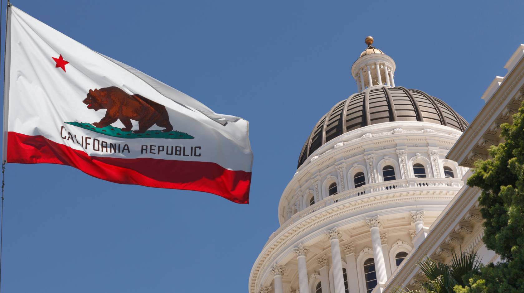 California flag flying outside the capitol building in Sacramento