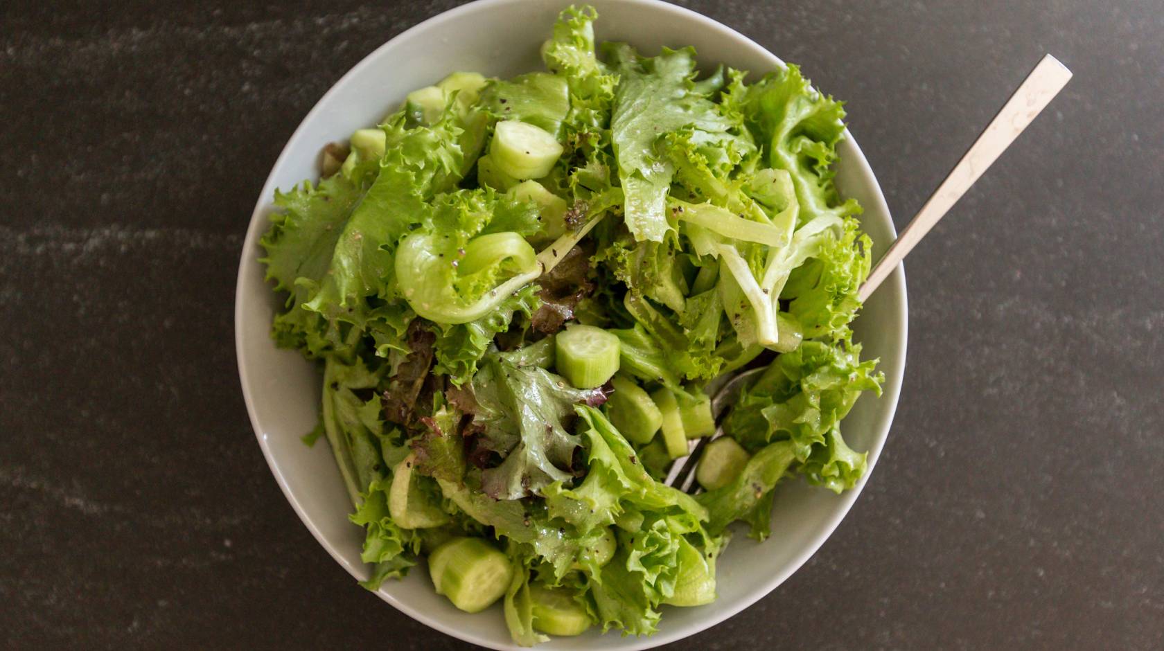 A bowl of salad viewed from overhead