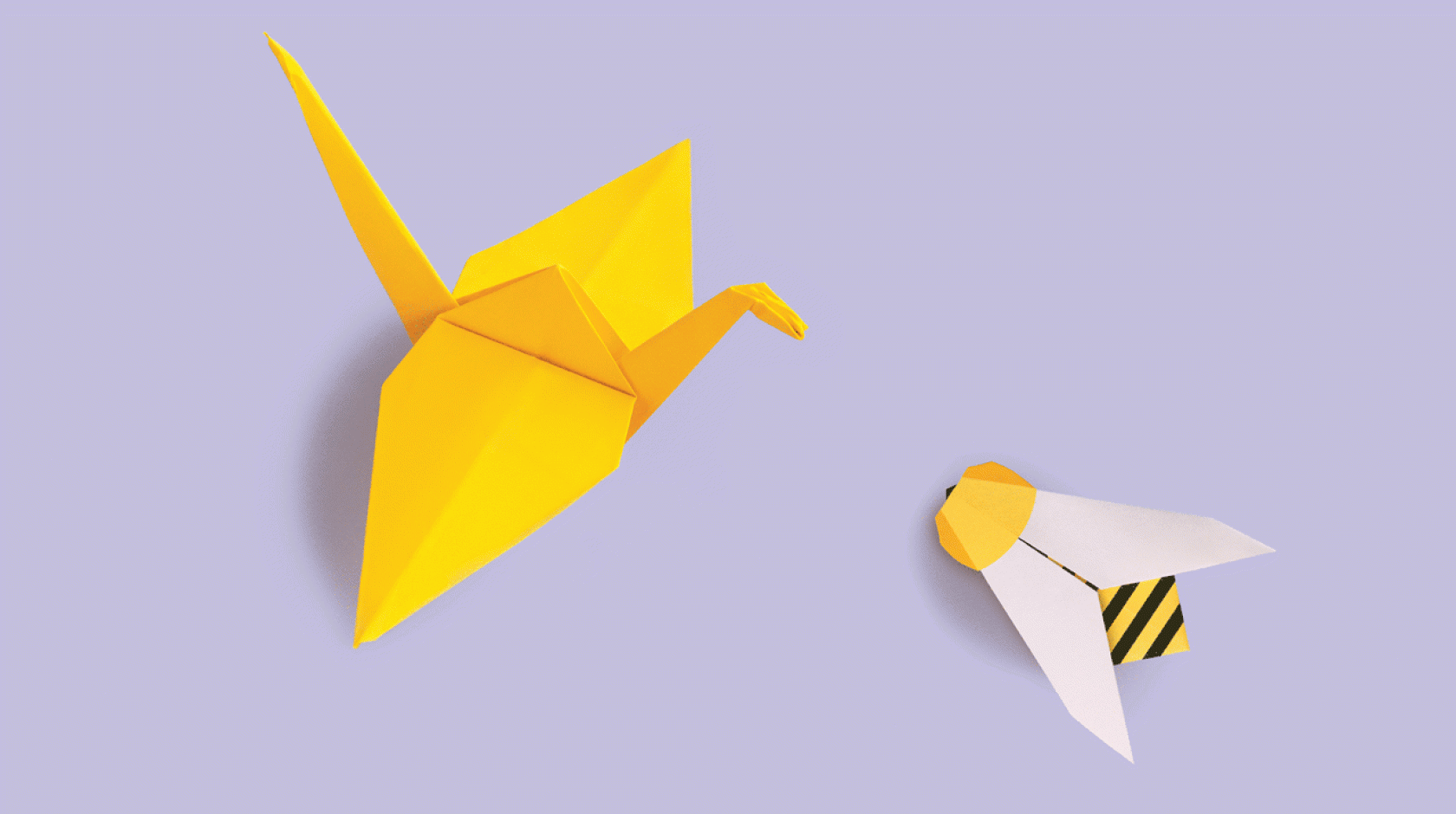 Origami crane and bee face each other