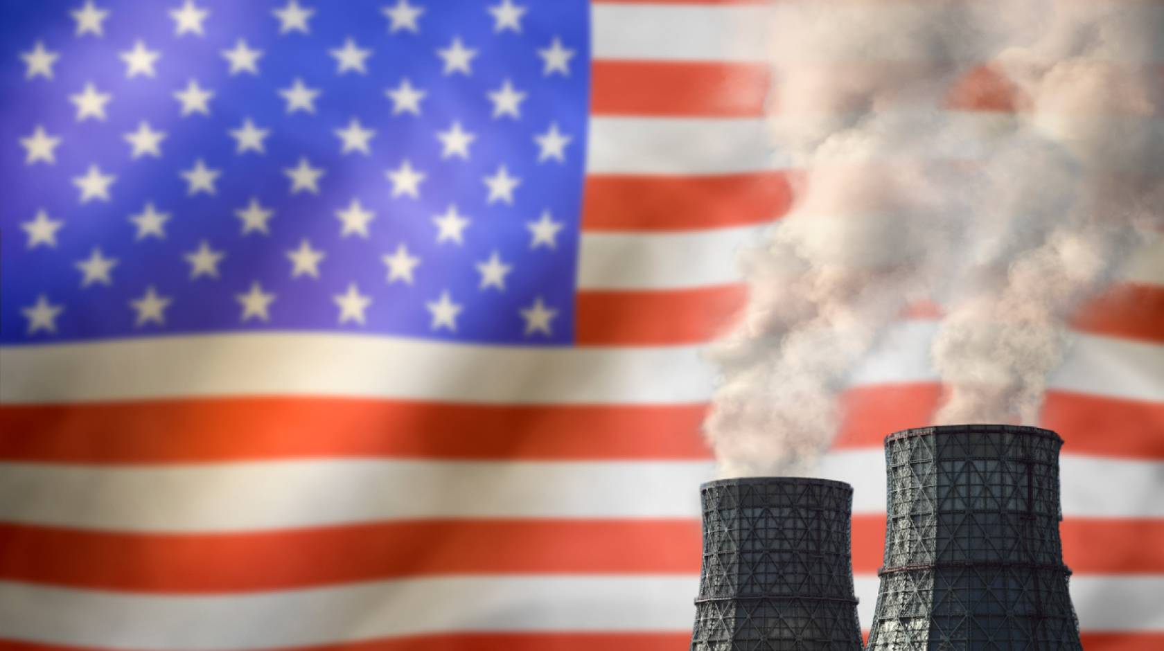 Smokestacks in front of an American flag