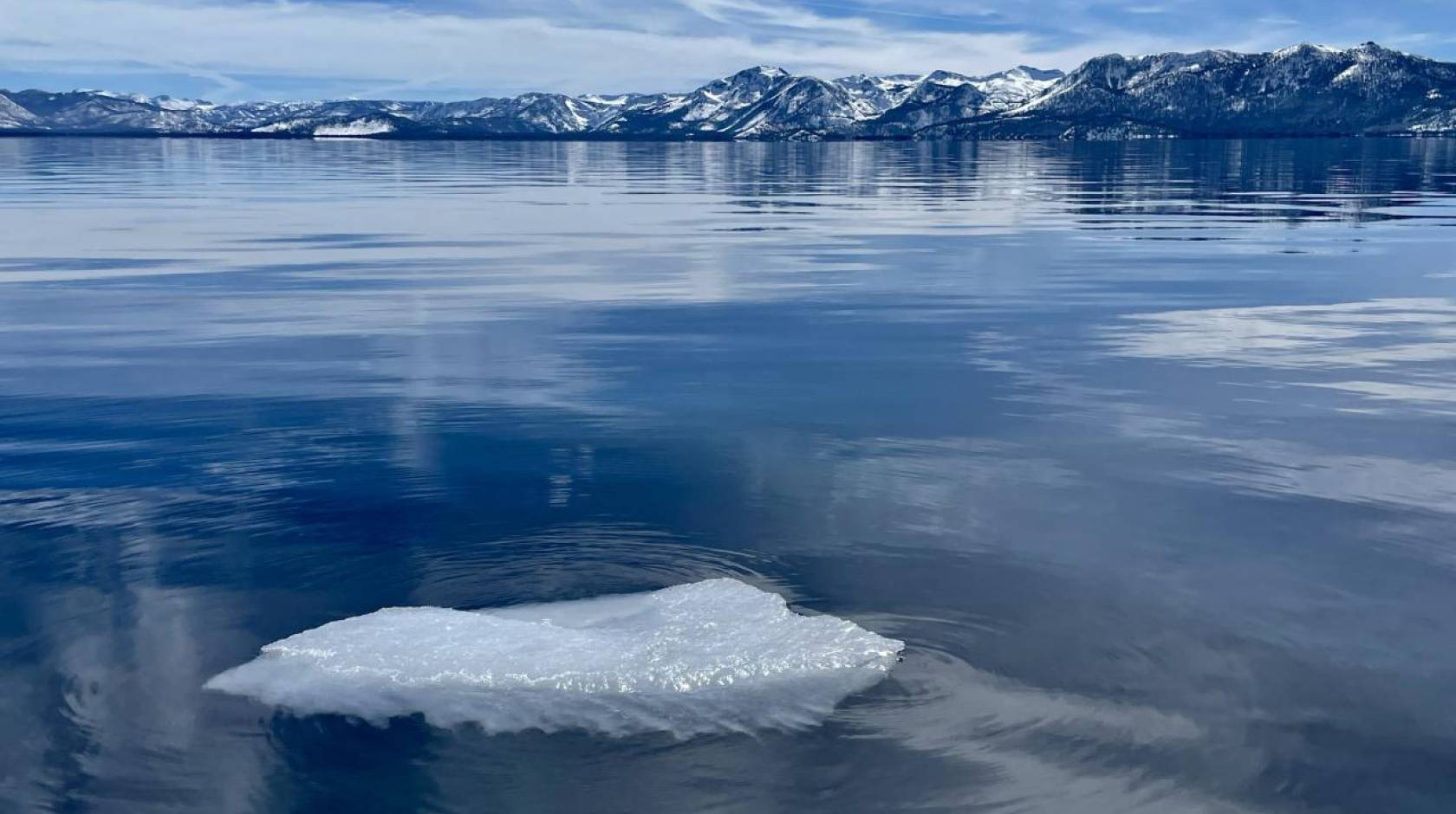 Lake Tahoe in winter with a block of ice in the forefront