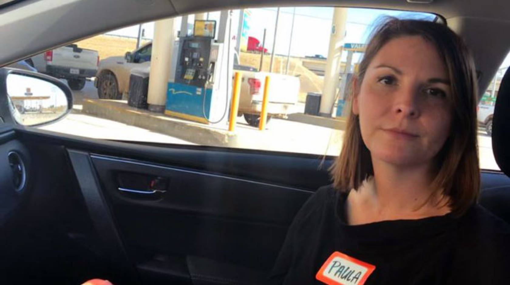 Paula Raffaelli in her car outside the Dilley detention facility for immigrants