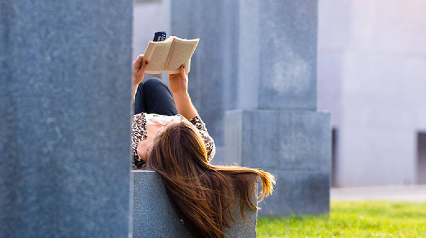 young woman reading book