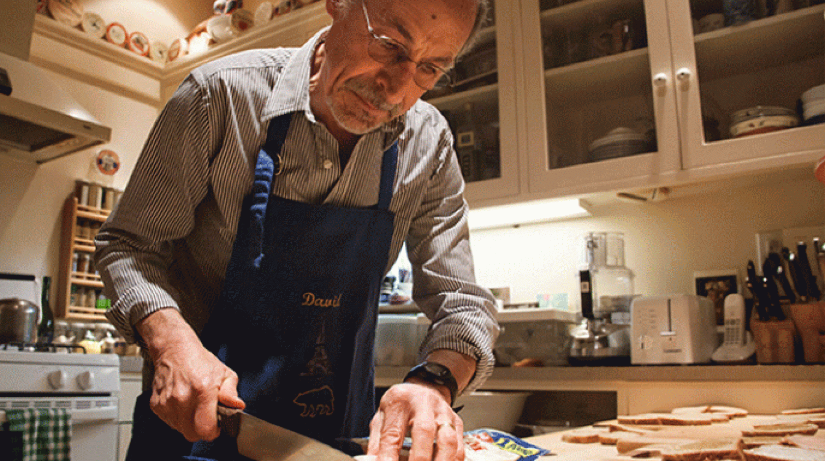 Starting around 5 a.m., David Kessler assembles sandwiches at his kitchen in the Oakland hills. 