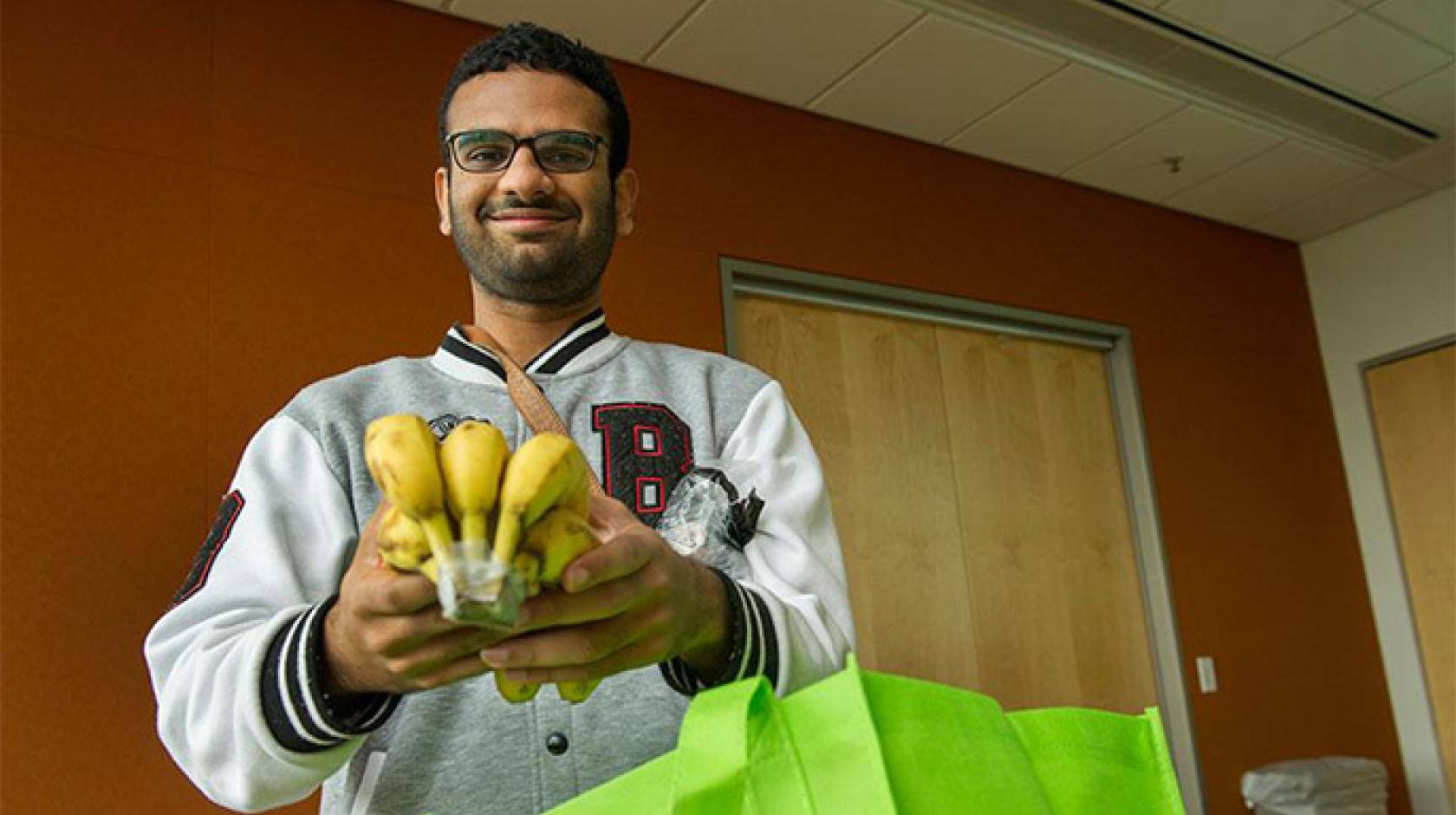 UC Davis graduate student Priyesh Shetty uses the free produce from the Fruit and Veggie Up! program to supplement his diet. 