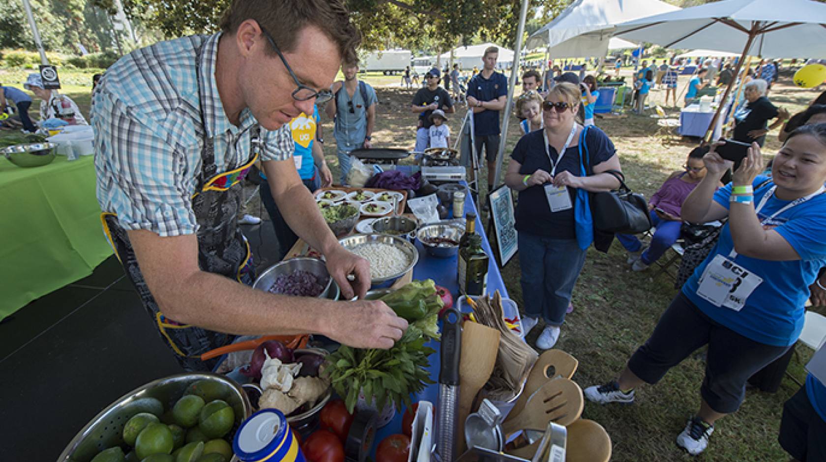 Visiting eco-chef Roger Feely makes grasshopper tacos during a demonstration of drought-friendly cooking at Festival of Discovery in Aldrich Park.