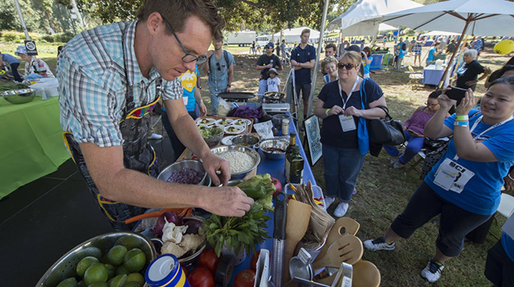 Visiting eco-chef Roger Feely makes grasshopper tacos during a demonstration of drought-friendly cooking at Festival of Discovery in Aldrich Park. 