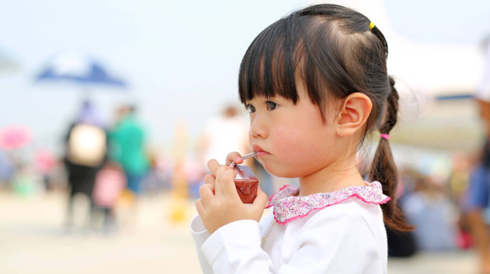 Child holding a juice box