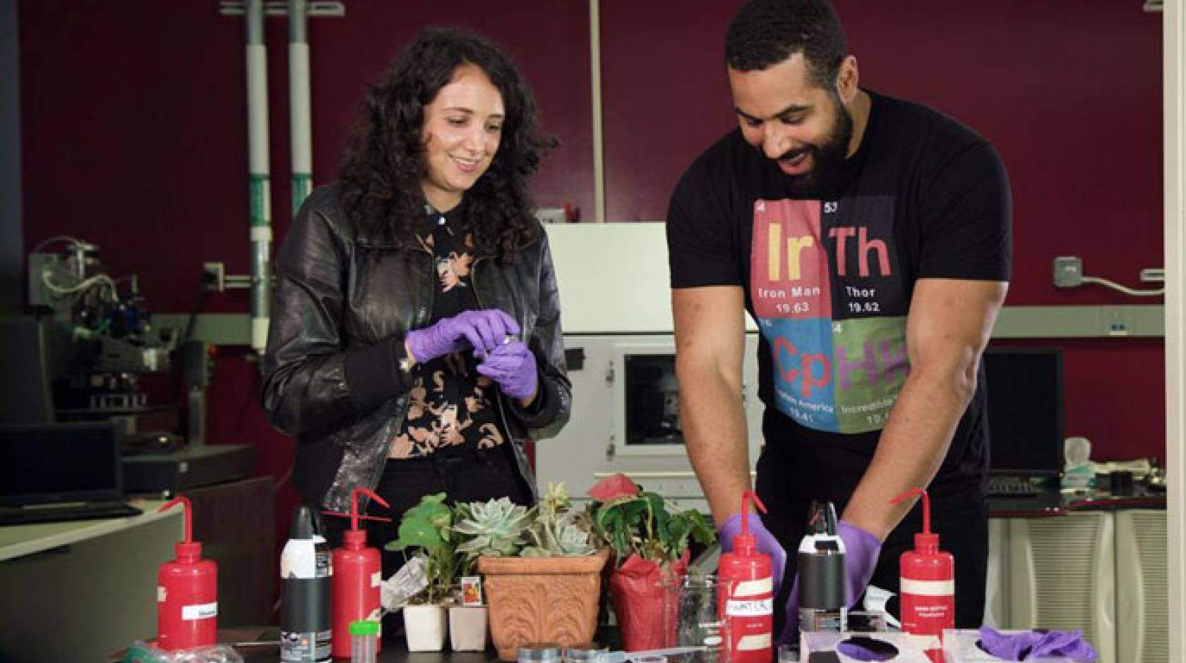 A man and a woman conduct a scientific experiment