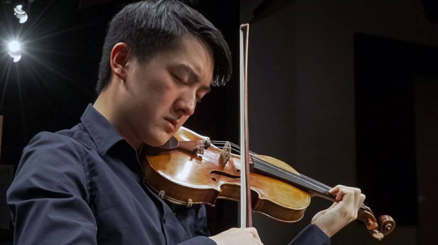 Elvin Hsieh playing the Stradivarius violin that was already owned by UCLA
