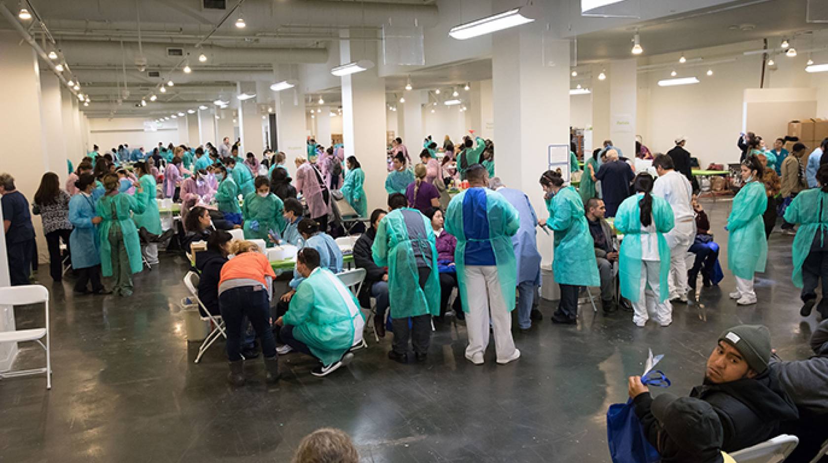 Volunteer dentists treat some of the 1,200 patients who received cleanings, fillings, extractions, partial dentures, root canals and oral cancer screenings at the 2017 Care Harbor Clinic.