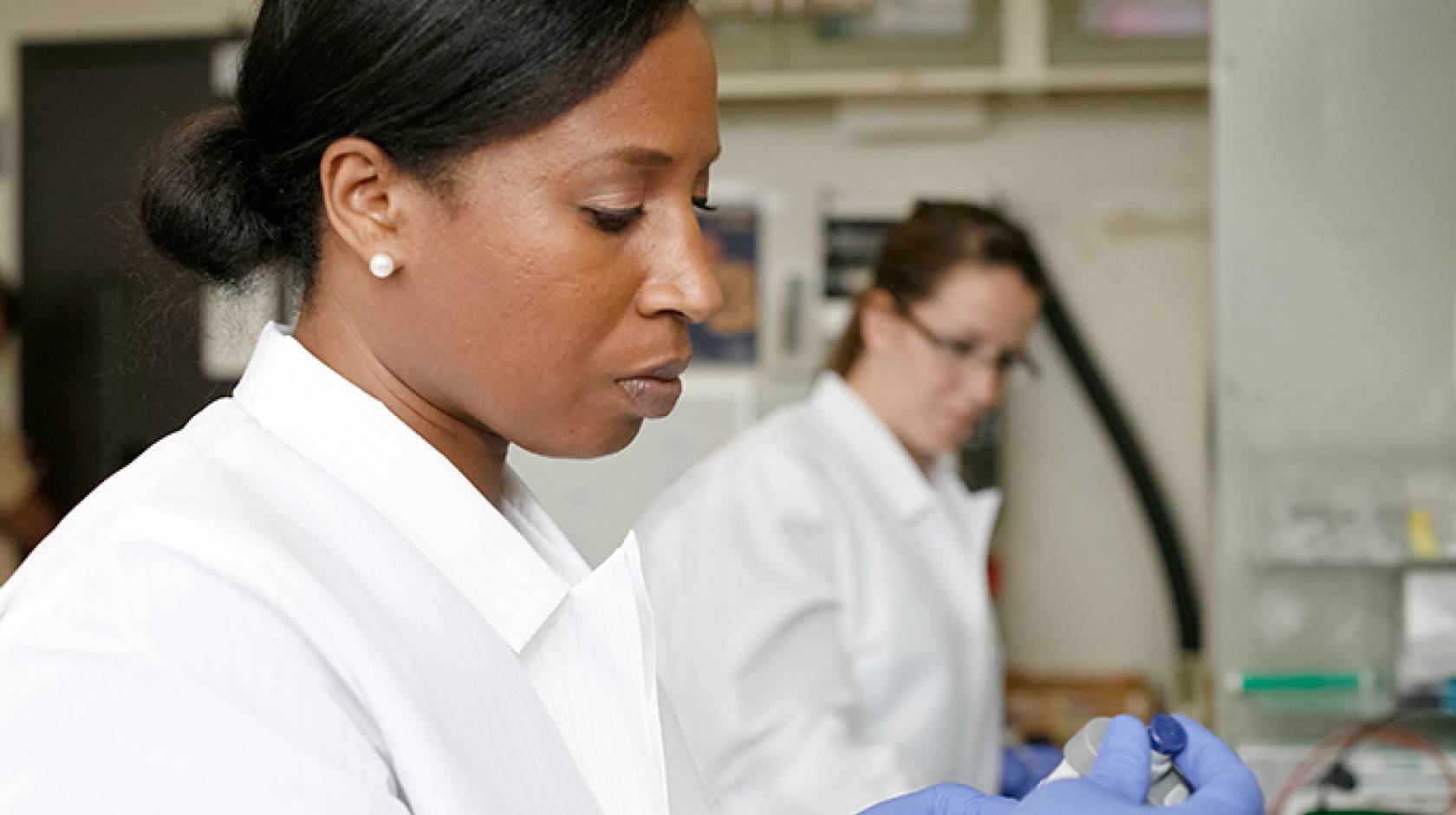 UCLA School of Nursing assistant professor and researcher Nalo Hamilton works in her lab.