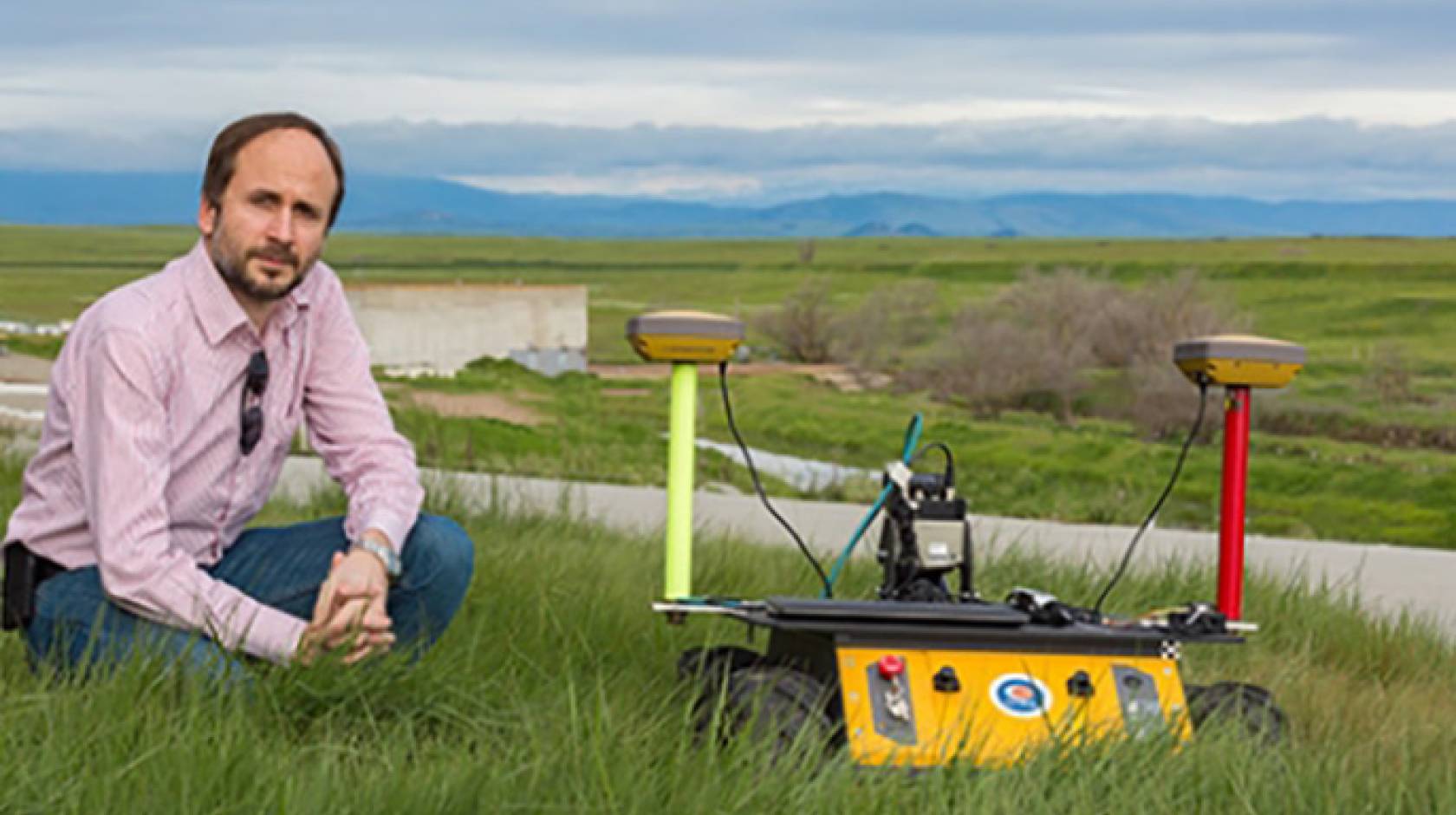 UC Merced professor Stefano Carpin and one of his robots