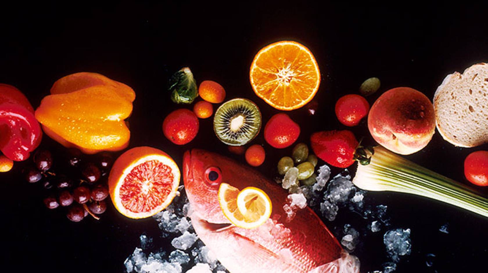 Some healthy foods, including fruit, vegetables, fish and bread.