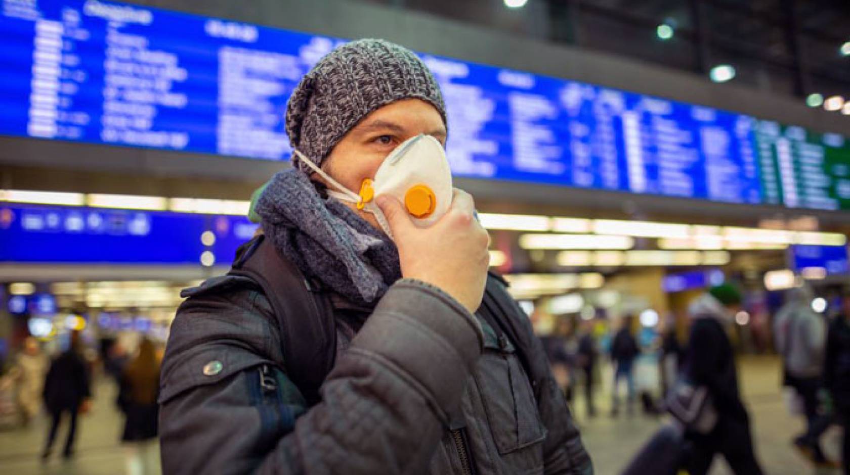 Man with a mask in an airport