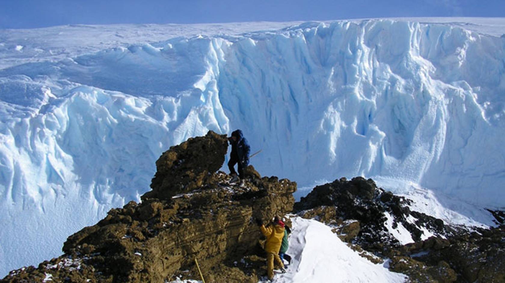 climbing rocks for samples - Antarctica