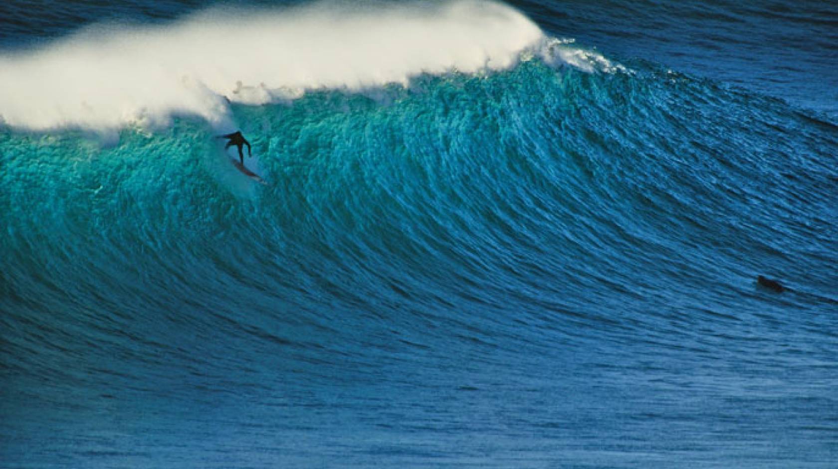 Surfer surfing on a big wave