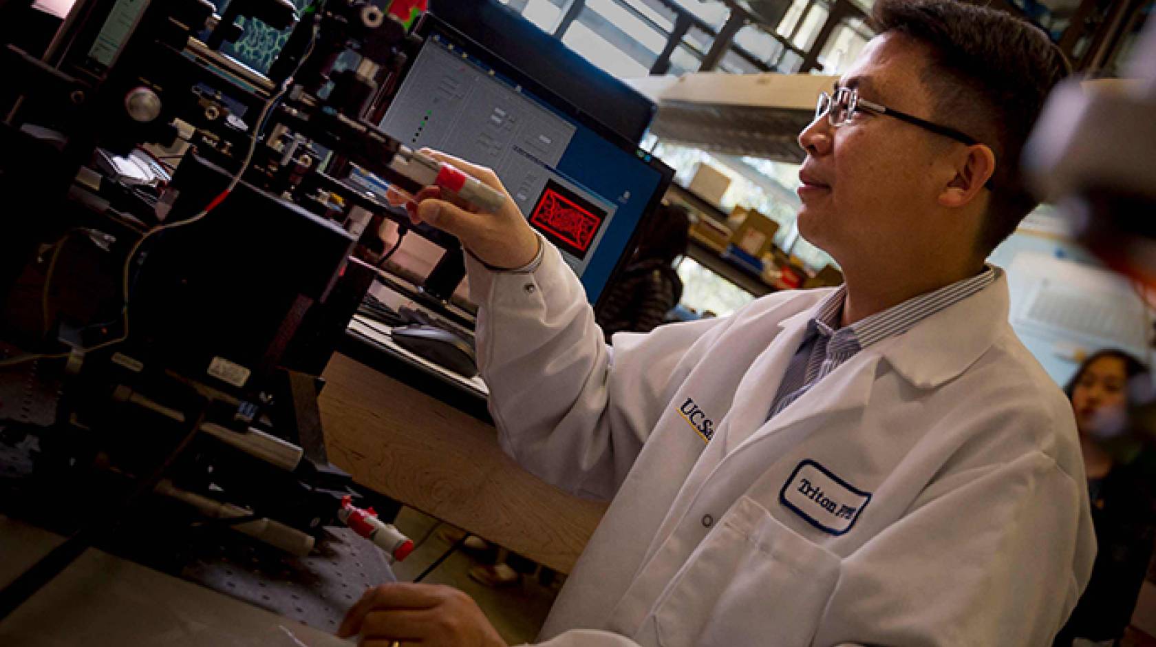 Nanoengineering professor Shaochen Chen 3D prints a biomimetic blood vessel network.
