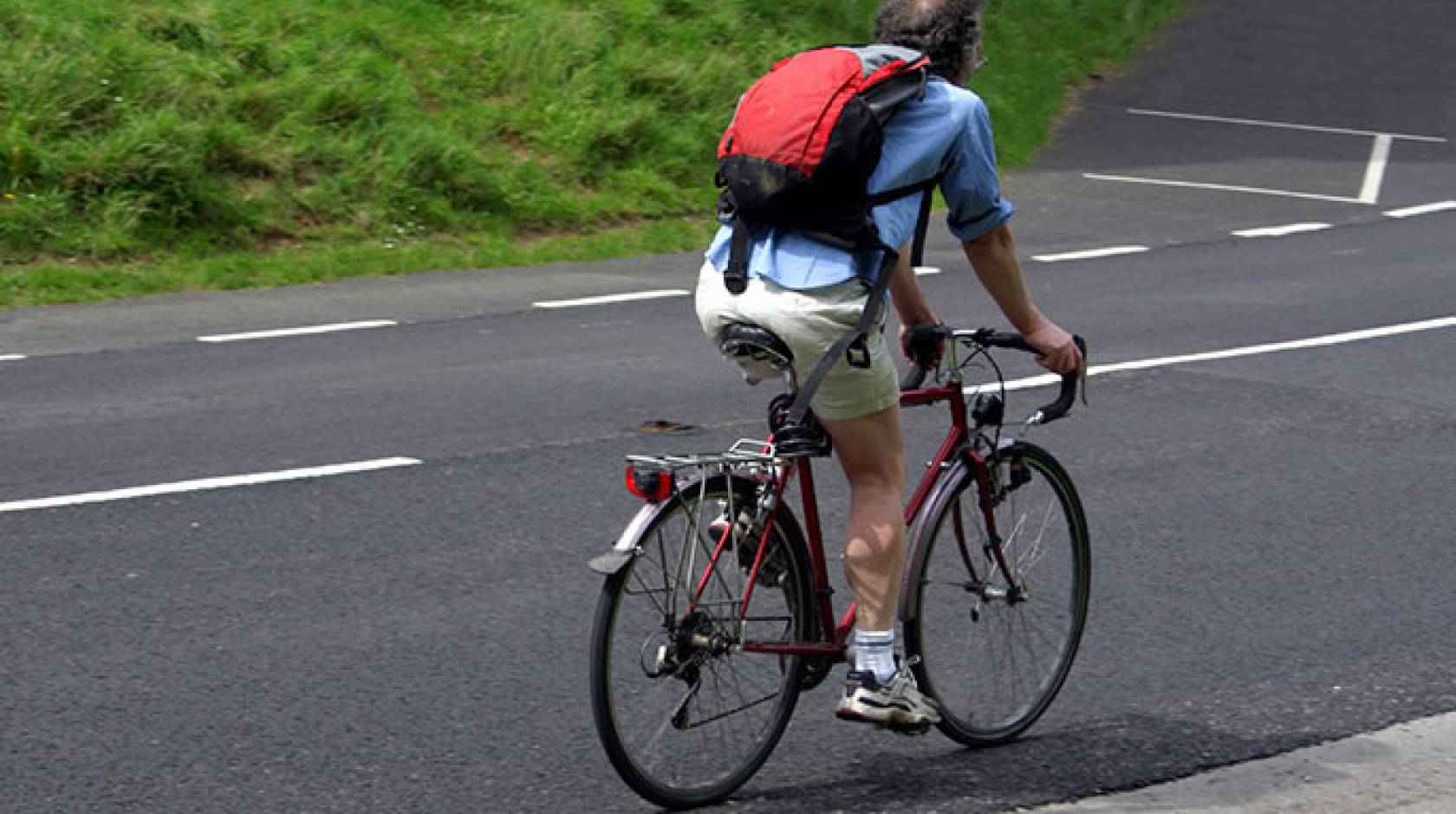 middle-aged man riding bicycle