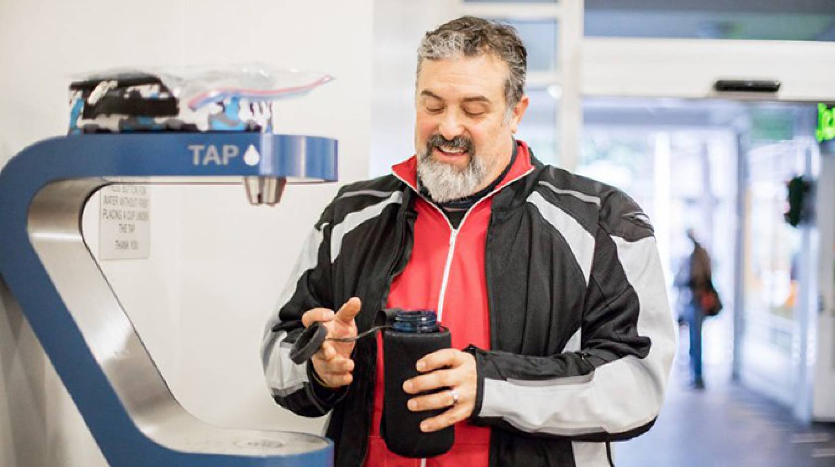 Dave Lieberman, a field mechanic at Scoot Networks, fills his water bottle at a water bottle refilling station in Millberry Union on UCSF’s Parnassus campus.