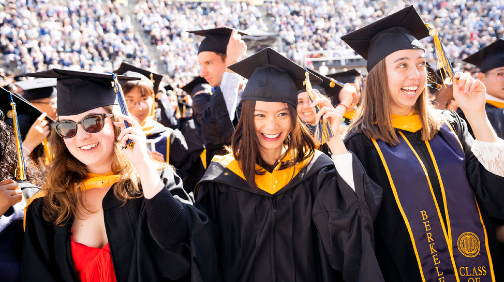 Students at UC Berkeley graduation turn their tassels