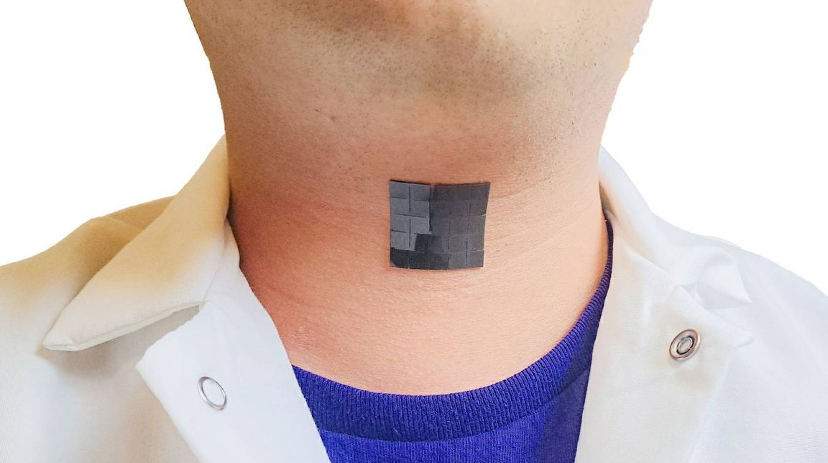 A black patch in the middle of a person's neck