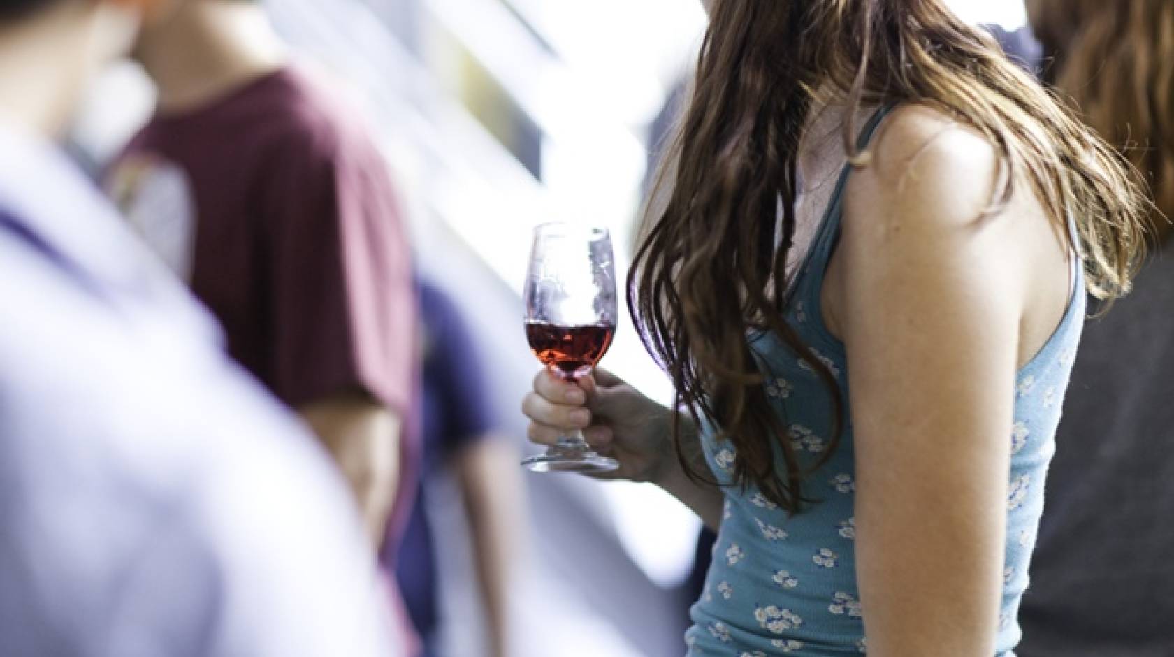 woman holding wine glass