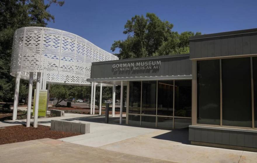 Entrance to the Gorman Museum, a white steel structure and one-story glass and concrete front