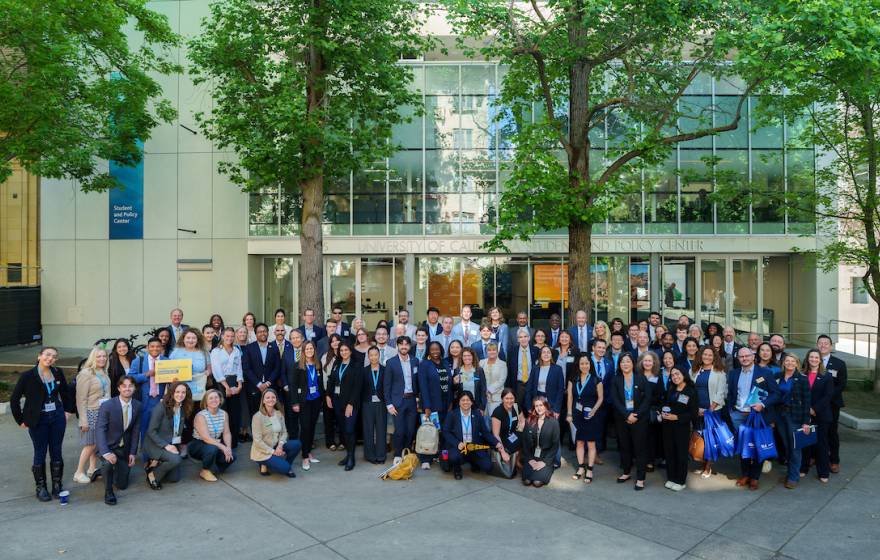 Advocates for UC, including students, faculty and staff, stand for a group photo.