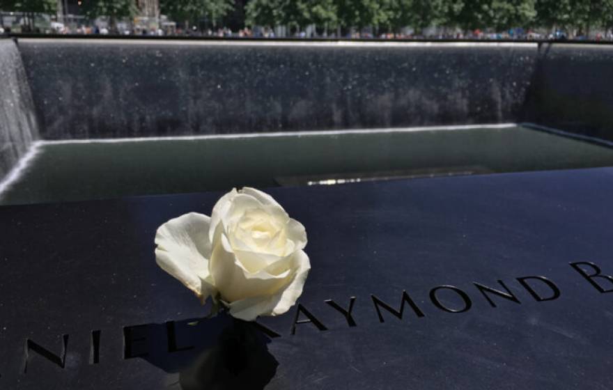 9/11 memorial with a white rose