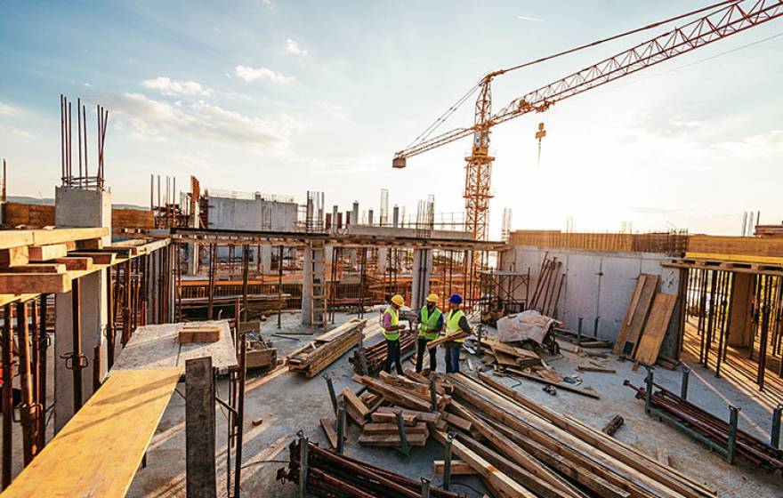 Construction workers at an urban building site