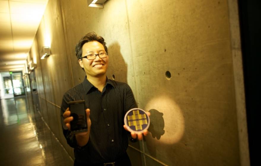 researcher holding prototypes