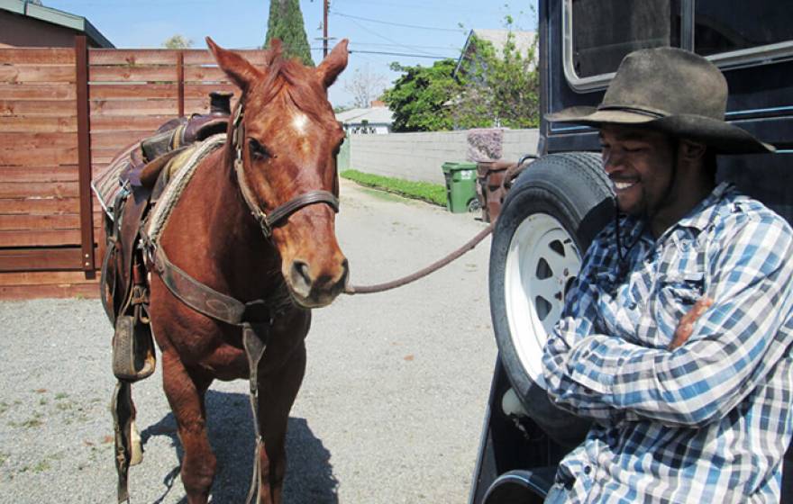 Derrick Jennings never goes without his hat, boots or cowboy belt buckle. He wears them so it's clear to people that he's a hardworking cowboy.