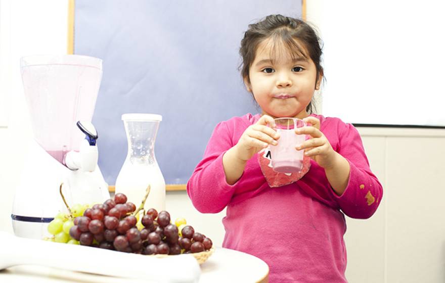 Girl holding fruit drink