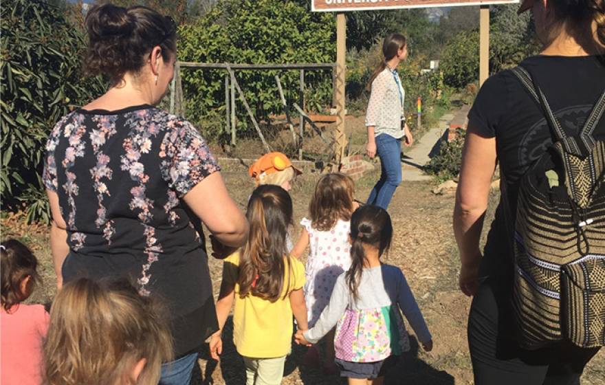 Preschoolers from the Orfalea Family Children’s Center at UCSB enter the campus Greenhouse & Garden Project for a lesson in gardening.