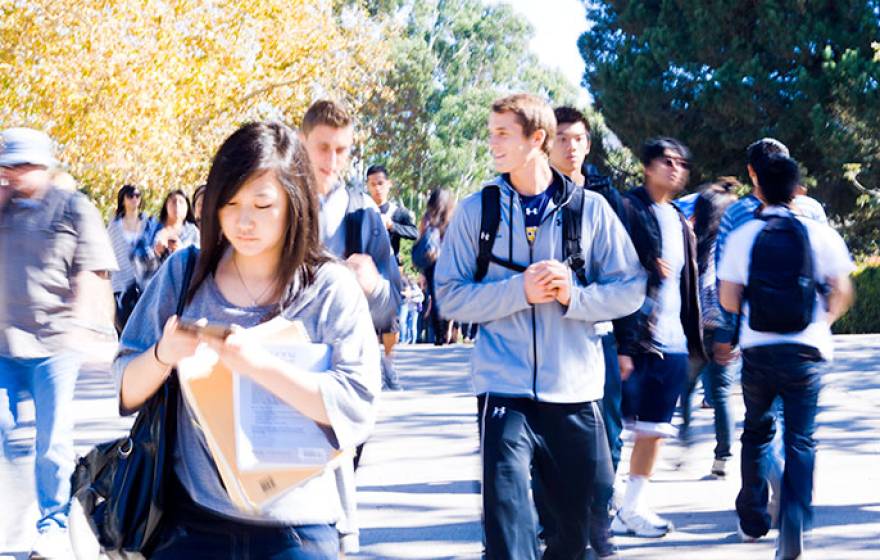 Students walk across UC Irvine campus