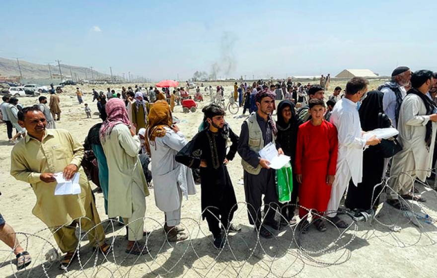 People gathered outside the airport in Kabul