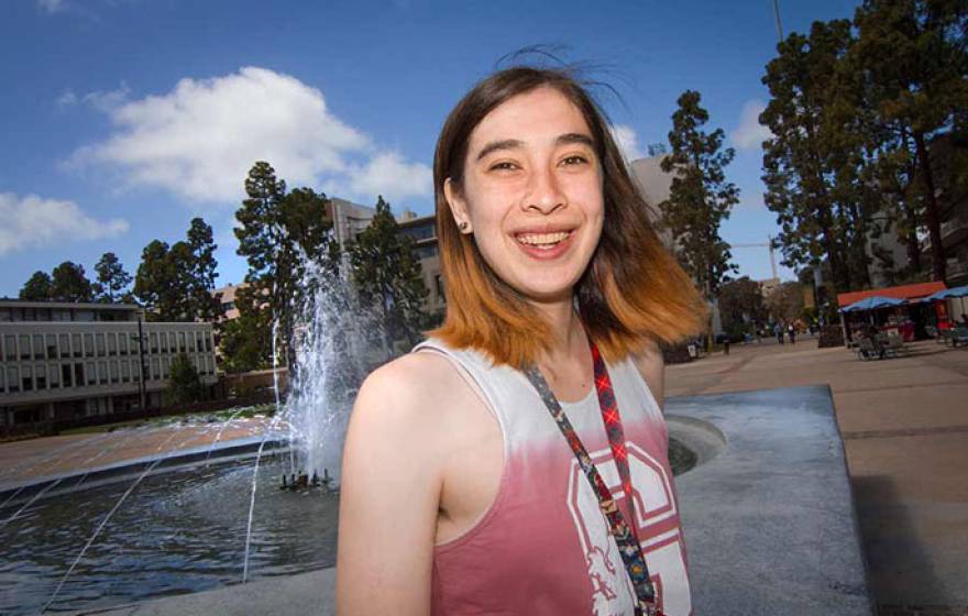 Amber in front of a fountain