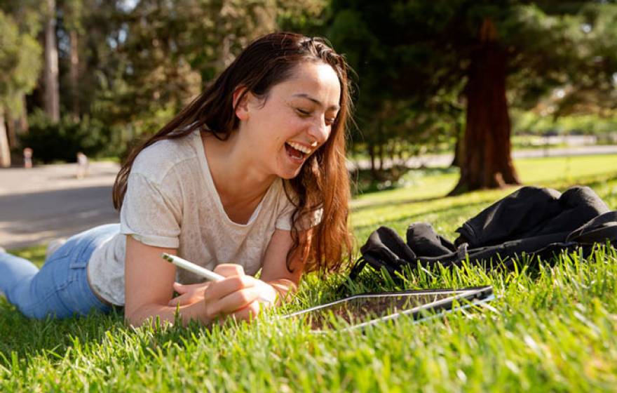 Anna Boser studying on the green