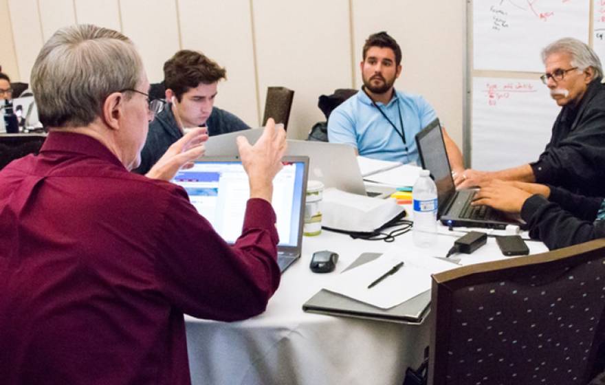 Winning team, Ag for Hire, brainstorms its app at the Apps for Ag Hackathon with the UC Davis World Food Center.