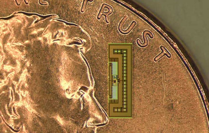 ant-sized radio (atop coin for comparison)
