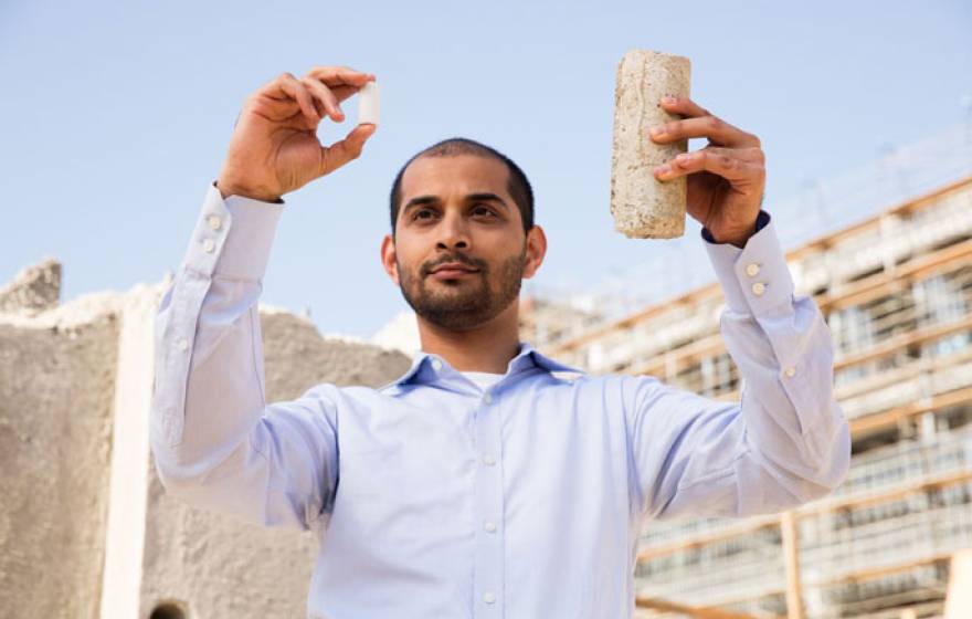 Gaurav Sant holding samples of concrete