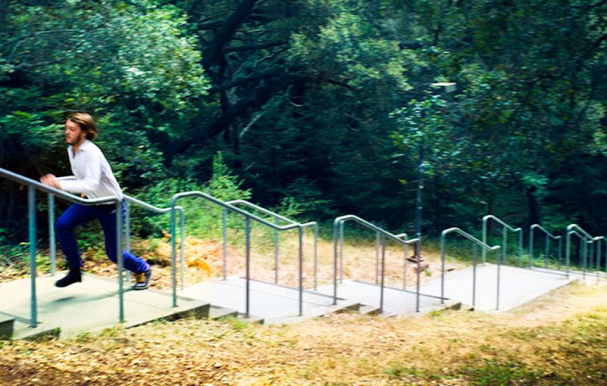 student climbs outdoor stairs