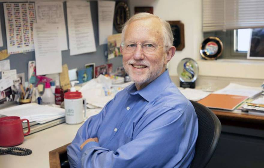 Charles Rice at desk