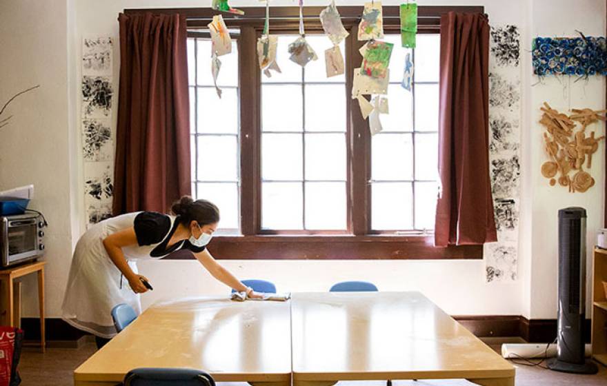 Woman cleaning child care facility