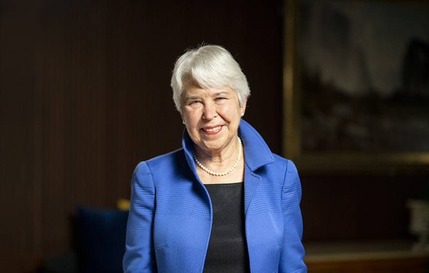 UC Berkeley Chancellor Carol Christ, smiling woman with short white hair, in blue jacket