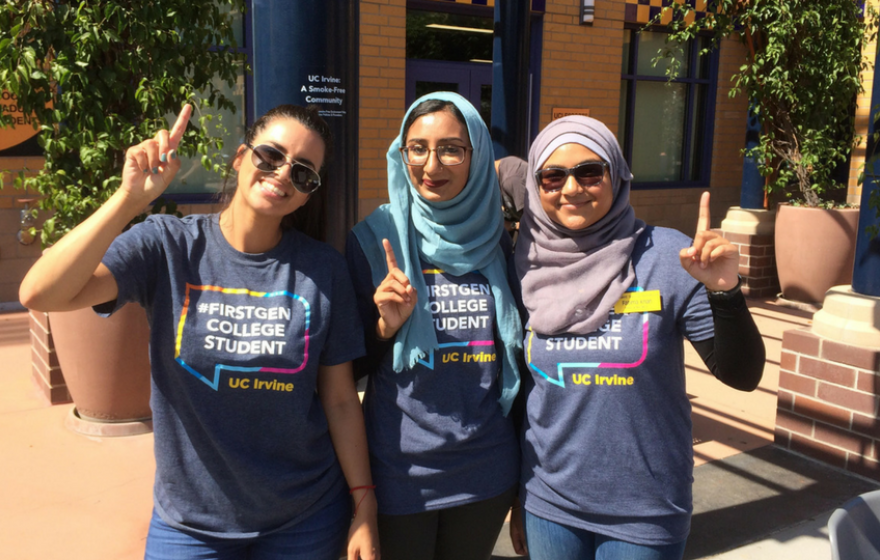 First-gen students pose for picture in first-gen T-shirts